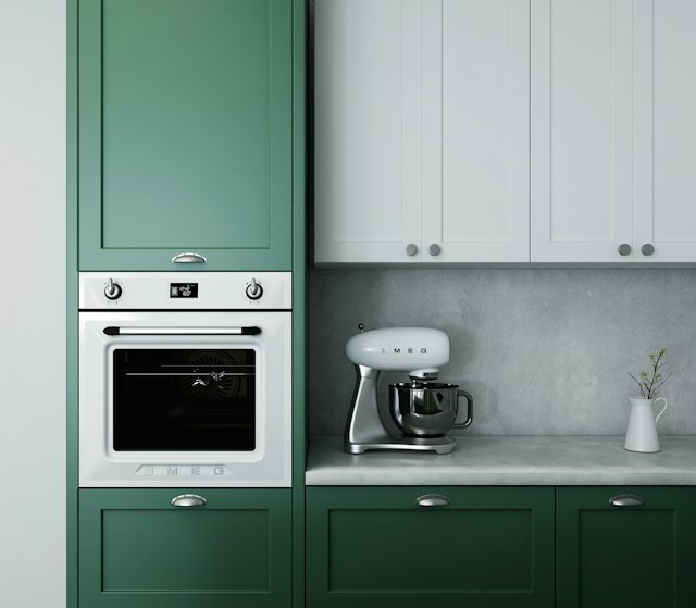 A modern kitchen with a raised oven.