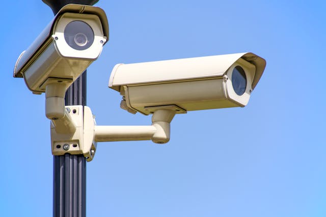 Two outdoor security cameras.