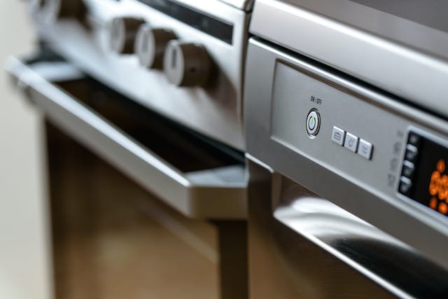 A close shot of the controls on an oven.