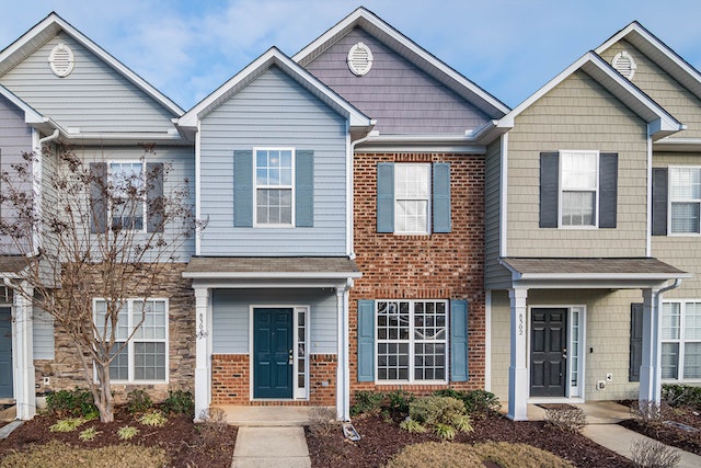 The exteriors of a cluster of houses.