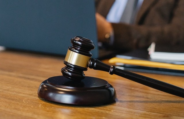 A judge’s gavel on a desk.