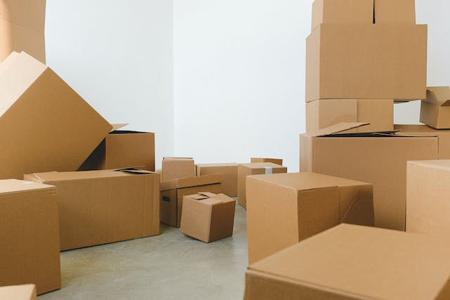 Several moving boxes stacked in a room.